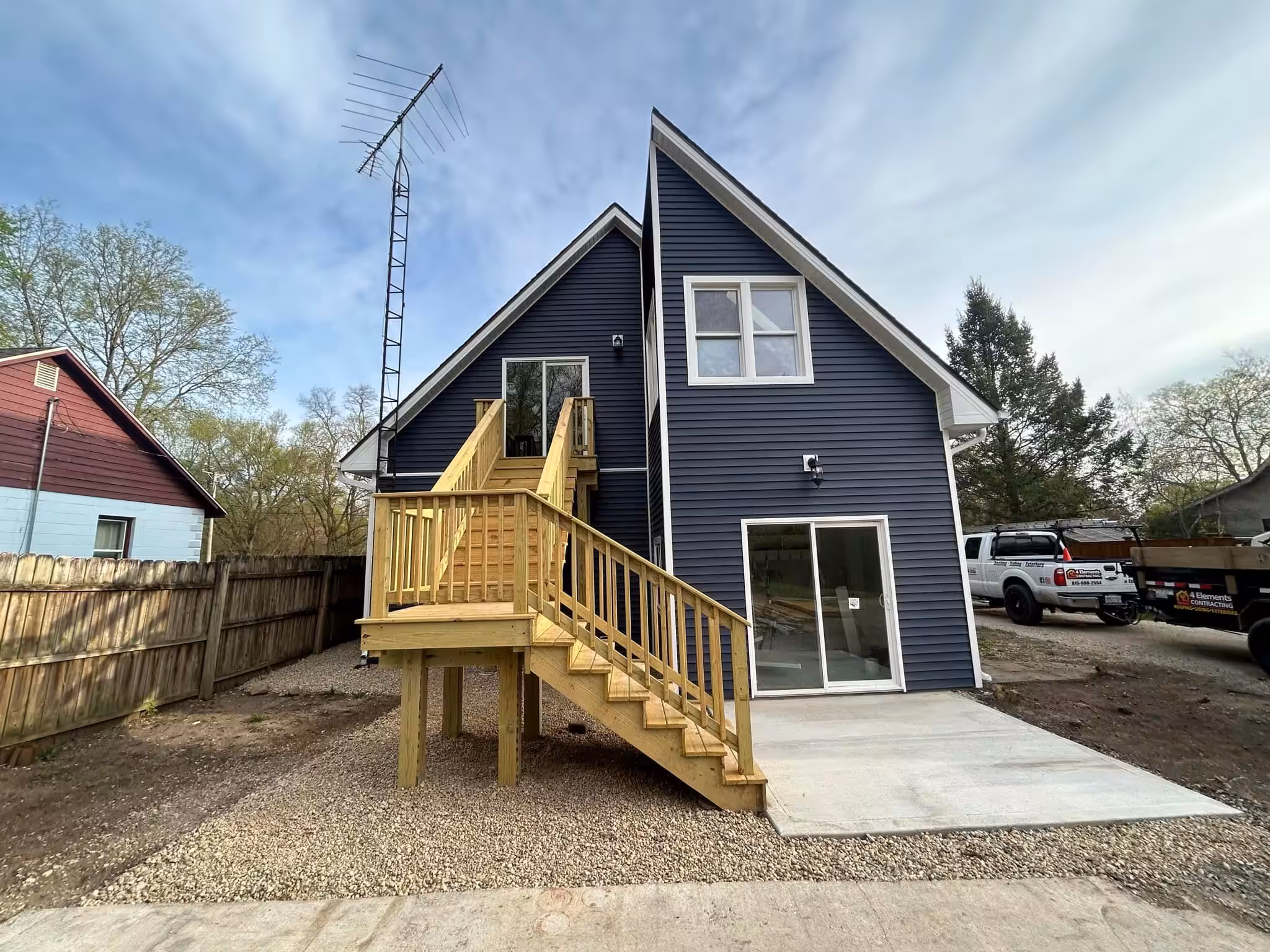 Modern blue house with stairs and deck